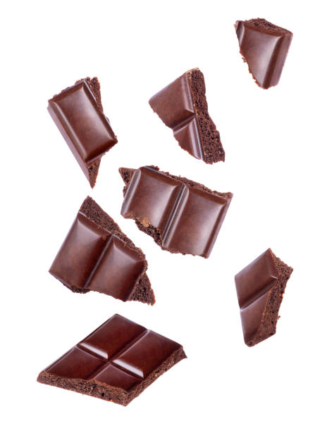 istock Pieces of porous chocolate falling close up on a white background 936326122