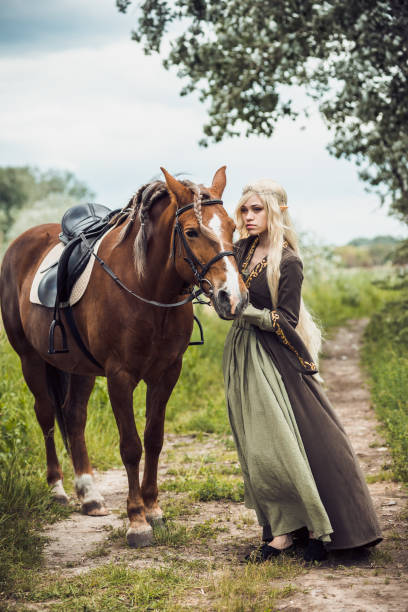 istock Elf woman in the forest with 936331062
