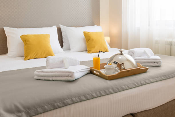 Breakfast served on a hotel bed stock photo