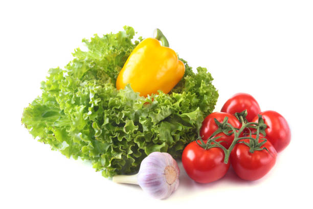 istock Fresh assorted vegetables bell pepper, tomato, garlic with leaf lettuce. Isolated on white background. Selective focus. 936332034
