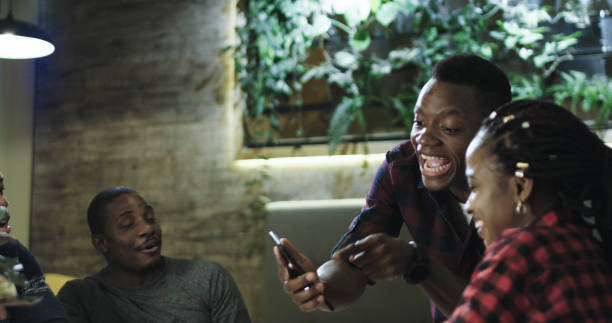 Young man sharing interesting story with friends