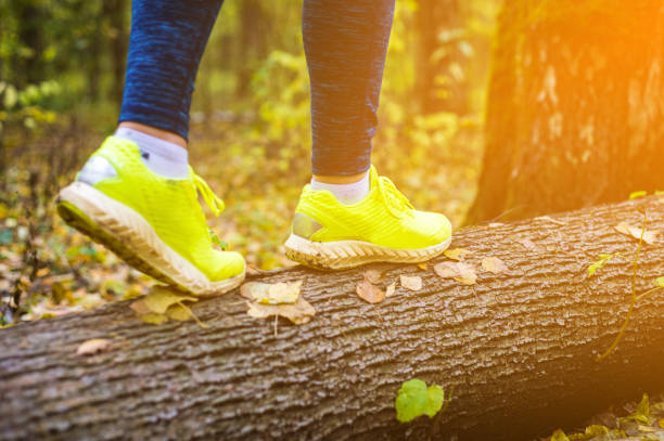 istock The girl is walking on road in forest 936332718