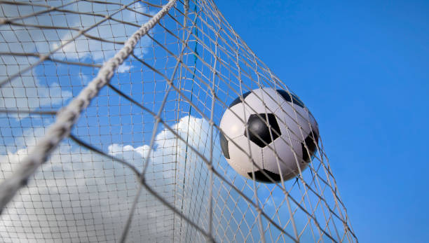 istock Soccer ball in a net 936332756