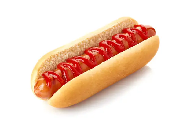 Photo of Hot dog with ketchup on white