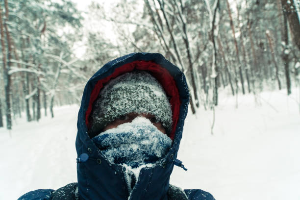 istock Winter. The man's face is covered with snow 936337030