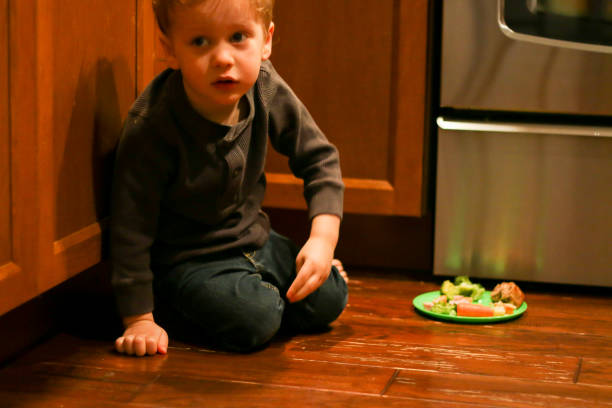 istock Happy Child Eating in Domestic Kitchen 936337608
