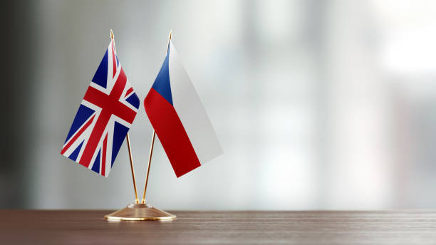 istock British And Czechoslovakian Flag Pair On A Desk Over Defocused Background 936345614