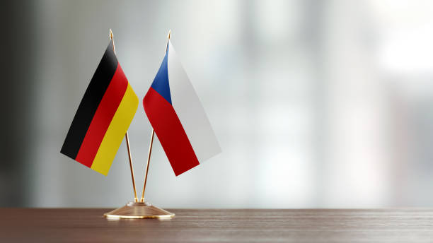 istock German And Czechoslovakian Flag Pair On A Desk Over Defocused Background 936345740