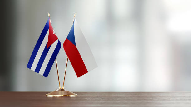 istock Cuban And Czechoslovakian Flag Pair On A Desk Over Defocused Background 936346036