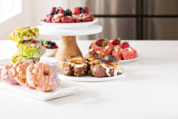 istock Variety of donuts on a table 936346252