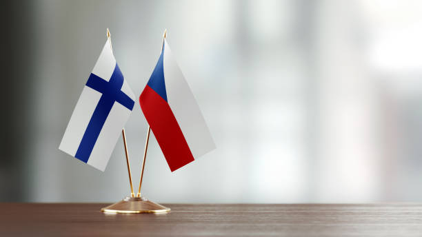istock Finnish And Czechoslovakian Flag Pair On A Desk Over Defocused Background 936346380