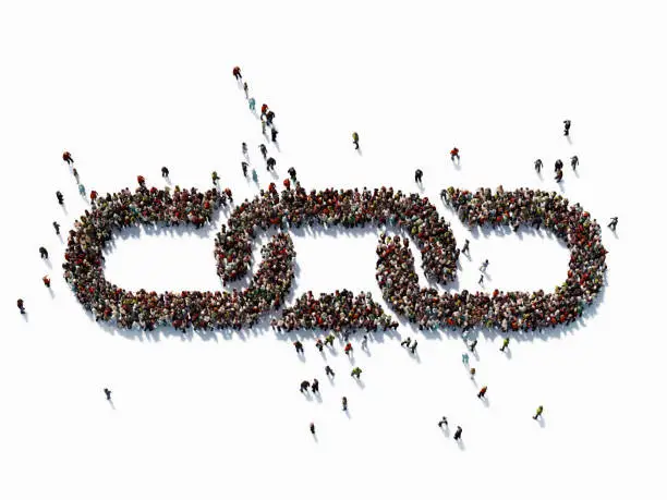 Human crowd forming a big chain symbol on white background. Horizontal  composition with copy space. Clipping path is included. Bonding and social Media concept.