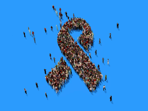 Human crowd forming an awareness ribbon symbol on blue background. Horizontal  composition with copy space. Clipping path is included. Awareness concept.