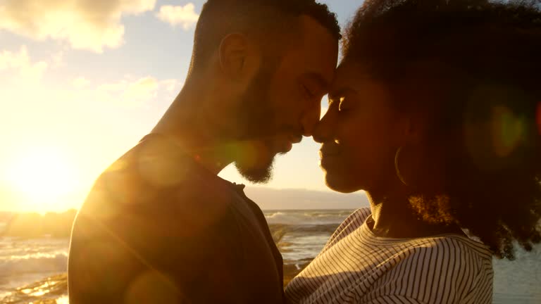 Couple embracing each other on the beach 4k