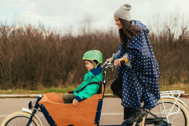 istock Mother and son riding a cargo bike 936349508