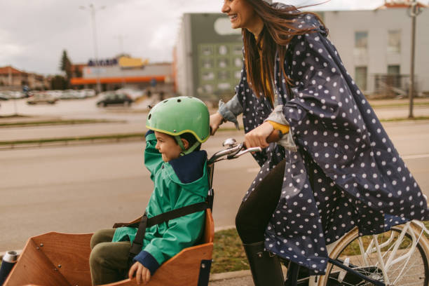istock Mother and son riding a cargo bike 936349644