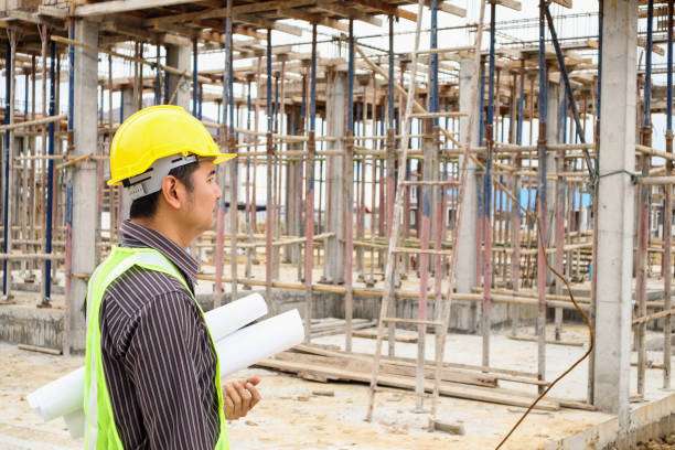 istock Asian business man construction engineer worker at house building site 936350090
