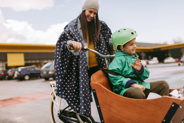 istock Mother and son going back from shopping with a cargo bike 936350880
