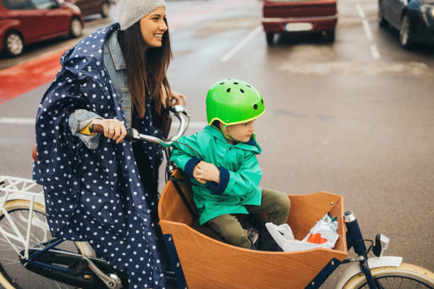 istock Mother and son going back from shopping with a cargo bike 936351102
