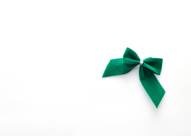 istock single green velvet bow isolated on white 936355260