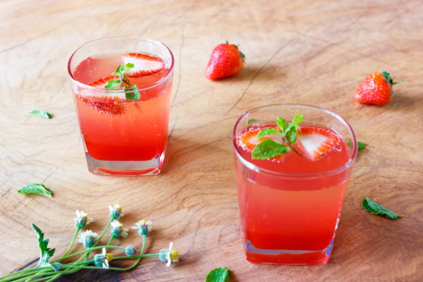 istock Summer strawberry drink on wooden table. 936357610