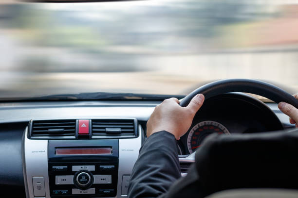istock Businessman driving his car 936357690