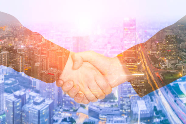 istock Deal or agreement business concept, handshake double exposure 936357730