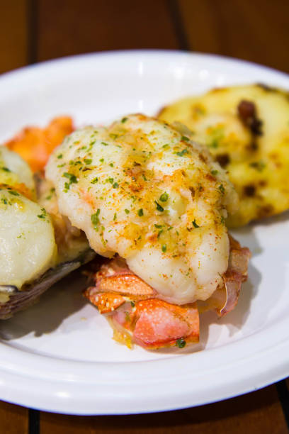 istock giant scallop with salmon and lobster tail 936360334