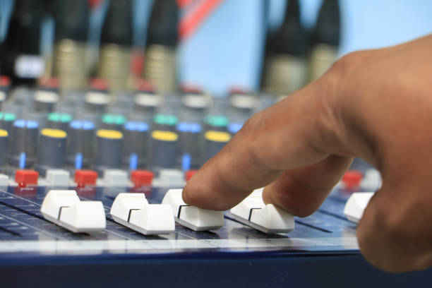 istock hand on a sound mixer control equipment old which has dust. select focus with shallow depth of field. 936361518