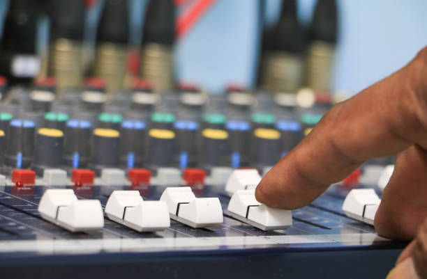 istock hand on a sound mixer control equipment old which has dust. select focus with shallow depth of field. 936361530