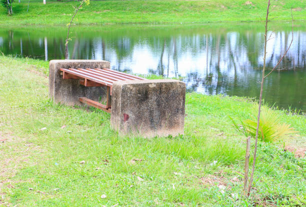 old chair riverside in public park