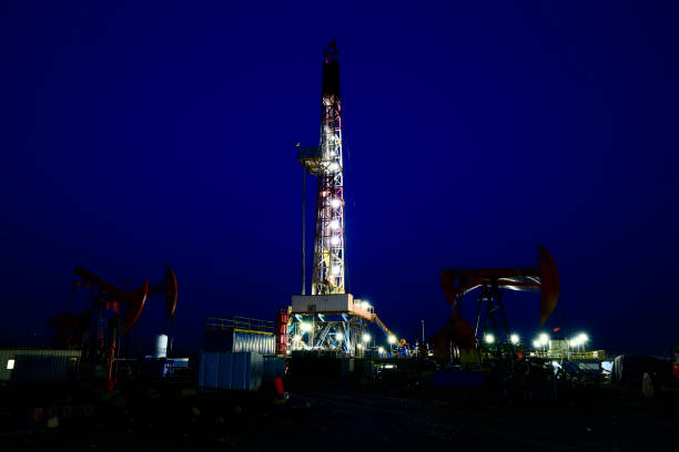 istock Oil drilling rig in the evening 936363598