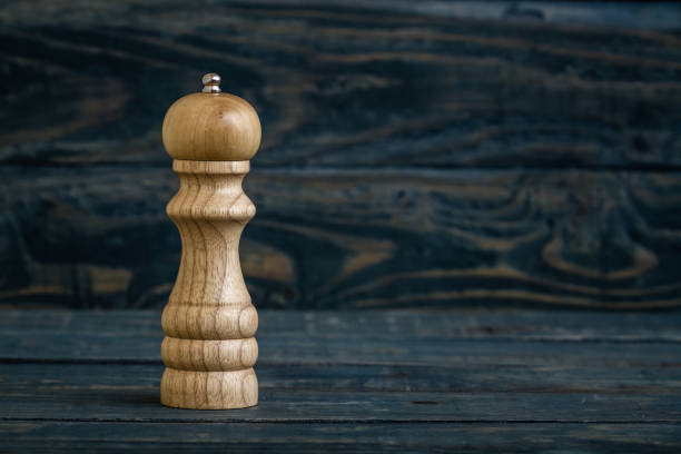 istock Wooden Peppermill on Blue Wooden Background 936364692