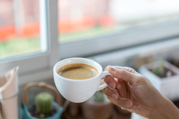 istock Hand holding a mug of hot coffee 936367844