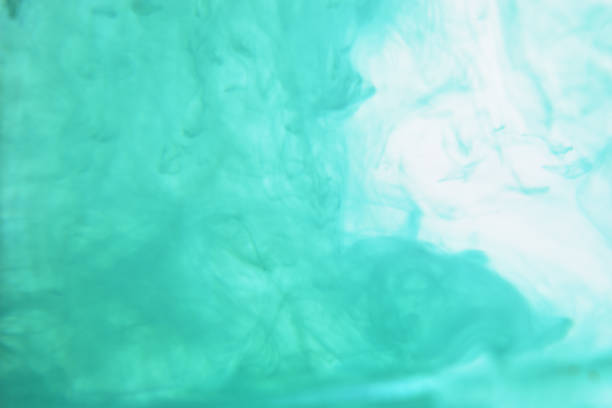 istock Blue ink spreading in the water 936369908