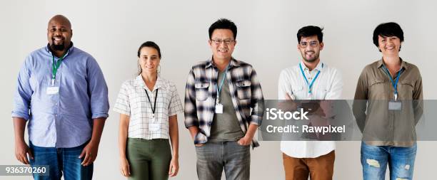 Workers Standing Together Diversity Stock Photo - Download Image Now - Name Tag, Photography, Employee