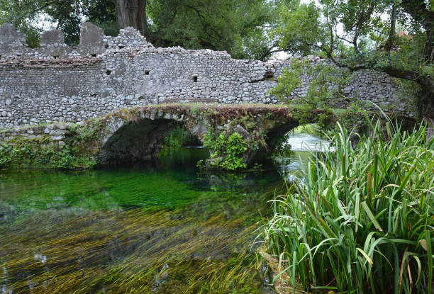 Garden of Ninfa (Latina, Italy) Garden of Ninfa, Italy - 21 July 2013 - A natural monument with medieval ruins in stone, flowers park and a awesome torrent with little fall. Province of Latina, Lazio region, central Italy. sermoneta stock pictures, royalty-free photos & images