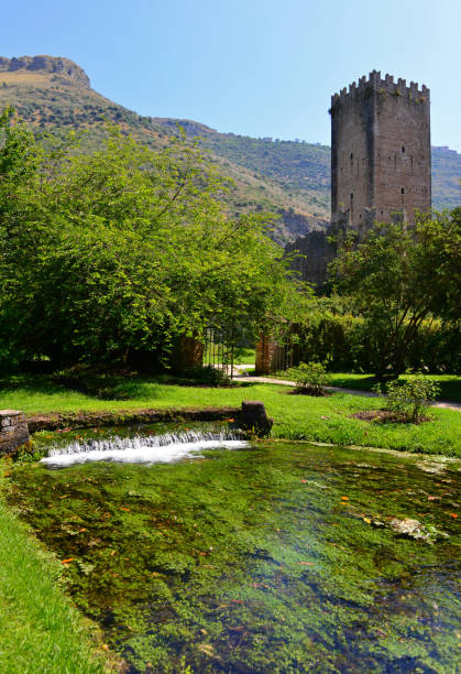 Garden of Ninfa (Latina, Italy) Garden of Ninfa, Italy - 22 June 2014 - A natural monument with medieval ruins in stone, flowers park and a awesome torrent with little fall. Province of Latina, Lazio region, central Italy. sermoneta stock pictures, royalty-free photos & images