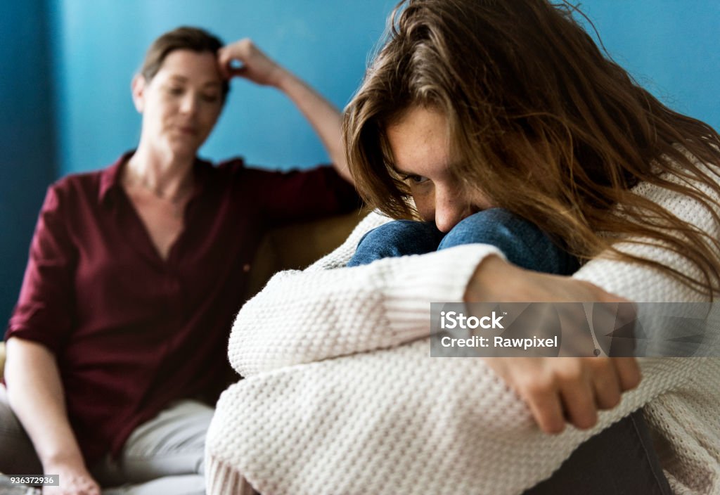 Mother and teenage daughter having an arguument Teenager Stock Photo