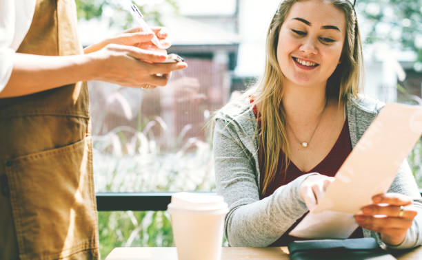 istock Woman ordering food at the restaurant 936373170