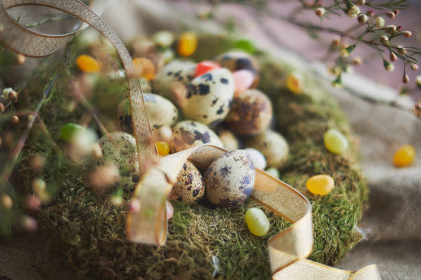 istock Easter arrangement with quail eggs and moss 936375258