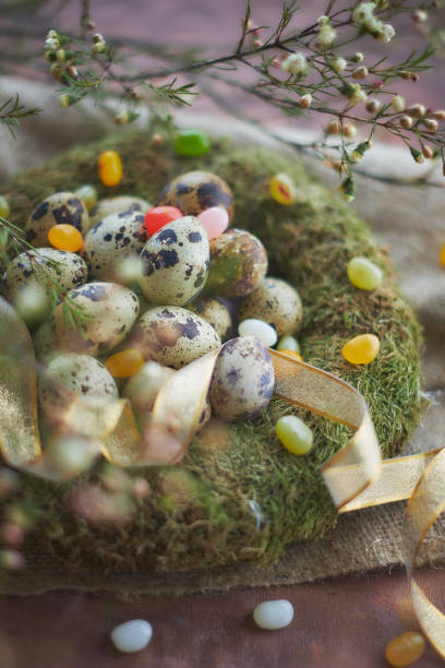 istock Easter arrangement with quail eggs and moss 936375264