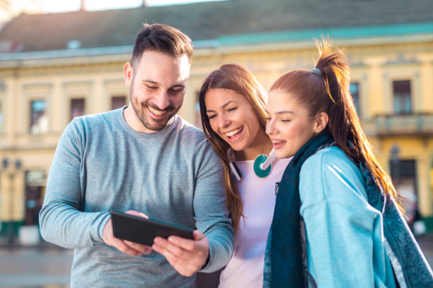 istock Group of smiling friends with digital tablet outdoor 936376984
