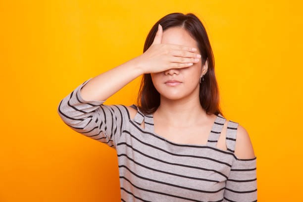 istock Young Asian woman close her eyes with hand. 936379376