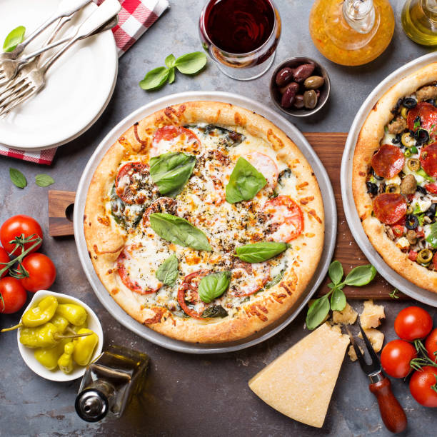 istock Margherita and pepperoni pizza with basil 936379522