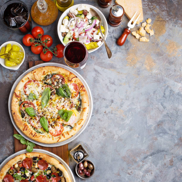istock Margherita and pepperoni pizza with basil 936379662
