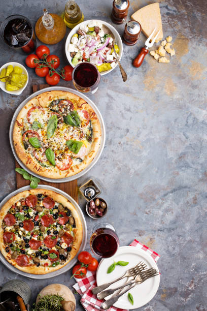 istock Margherita and pepperoni pizza with basil 936379696