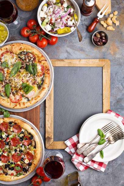 istock Margherita and pepperoni pizza with basil 936379812