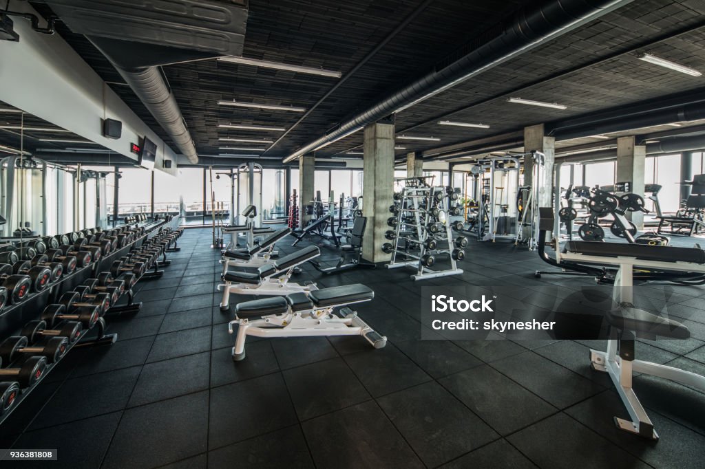 Gym without people with large group of exercise machines. Large group of exercise machines and equipment in a gym. Gym Stock Photo