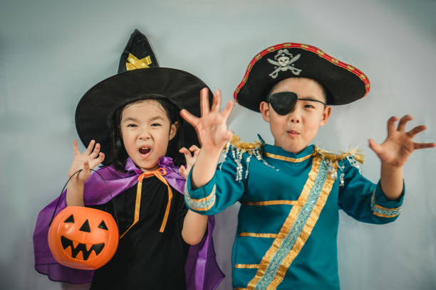 istock Happy brother and sisters on Halloween 936383902